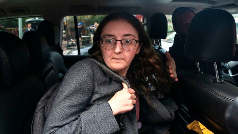 FILE - Caroline Ellison former CEO of Alameda Research founded by Sam Bankman-Fried goes into a wrong car as she exits the Manhattan federal court after testifying on Tuesday, Oct. 10, 2023, in New York. (AP Photo/Eduardo Munoz Alvarez, File)