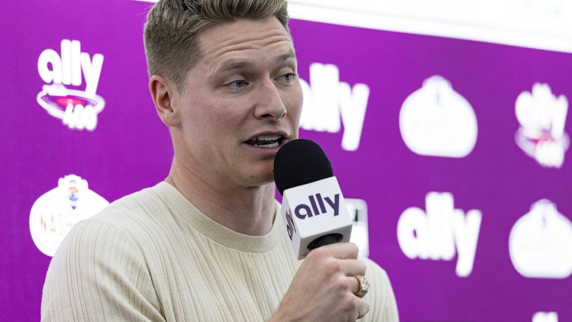 Two-time Indianapolis 500 winner Josef Newgarden speaks to reporters before a NASCAR Cup Series auto race, Sunday, June 30, 2024, in Gladeville, Tenn. (AP Photo/Wade Payne)