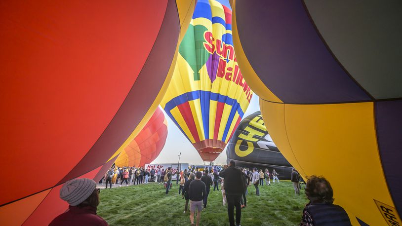 Spectators watch as hot air balloons take off during the mass ascension at the 52nd Albuquerque International Balloon Fiesta in Albuquerque, N.M., on Saturday, Oct. 5, 2024. (AP Photo/Roberto E. Rosales)