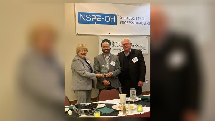 Sweet Manufacturing Company in Springfield has been awarded the Ohio New Product Award. Vice President of Engineering Chris Smith (middle) received the award on behalf of the company. From left to right are Tina Sutermeister, representing NSPE-Ohio’s Professional Engineers in Industry practice division; Smith; and NSPE-Ohio President Dennis Irwin. Contributed