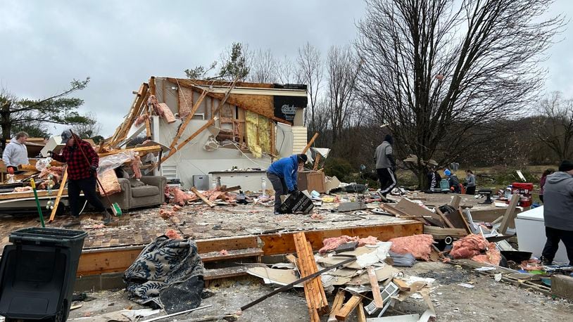 Around 100 people came to the Mitchell Road property of Jon and Rebekah Stewart to help clean their property Saturday morning after they lost nearly everything after a tornado hit on Wednesday.