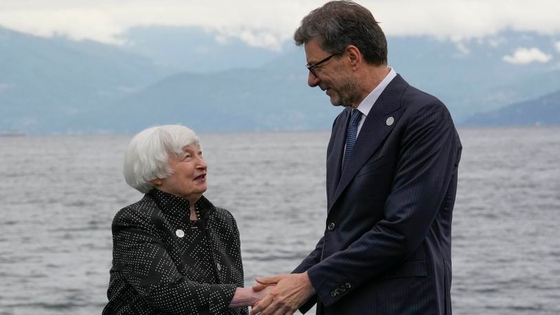 United States' Treasury Secretary Janet Yellen shakes hands with Italian Italy's Finance Minister Giancarlo Giorgetti as she arrives at the G7 Finance Ministers meeting in Stresa, northern Italy, Friday, May 24, 2024. (AP Photo/Antonio Calanni)