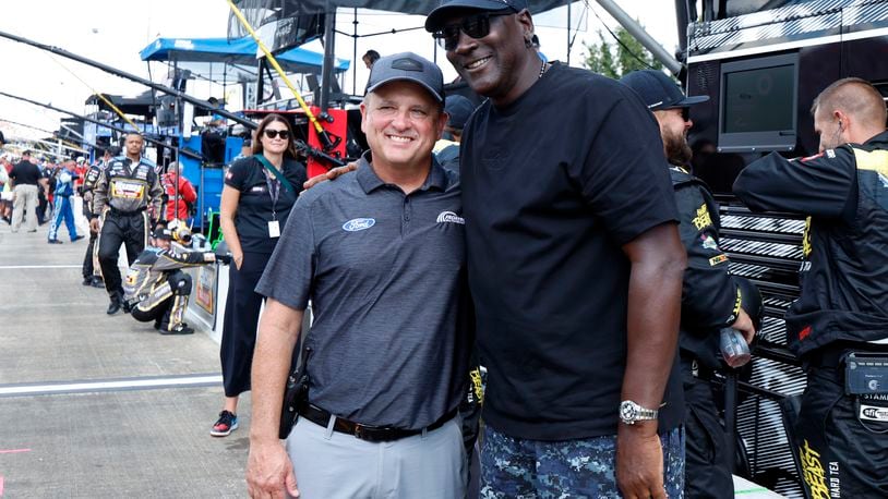 Bob Jenkins, owner of Front Row Motorsports and Co-Owner Michael Jordan, of 23XI Racing, pose before a NASCAR Cup Series auto race at Talladega Superspeedway, Sunday, Oct. 6, 2024, in Talladega, Ala. (AP Photo/ Butch Dill)