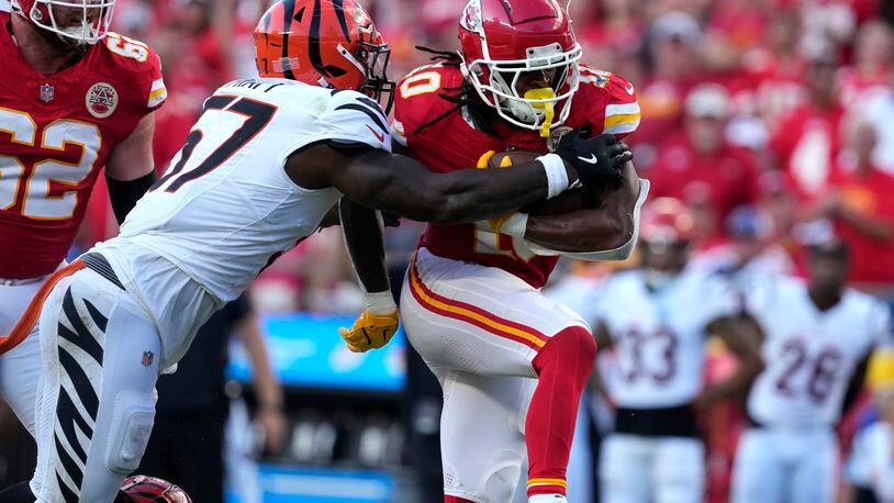 Kansas City Chiefs running back Isiah Pacheco, right, runs with the ball as Cincinnati Bengals linebacker Germaine Pratt (57) defends during the second half of an NFL football game Sunday, Sept. 15, 2024, in Kansas City, Mo. (AP Photo/Ed Zurga)