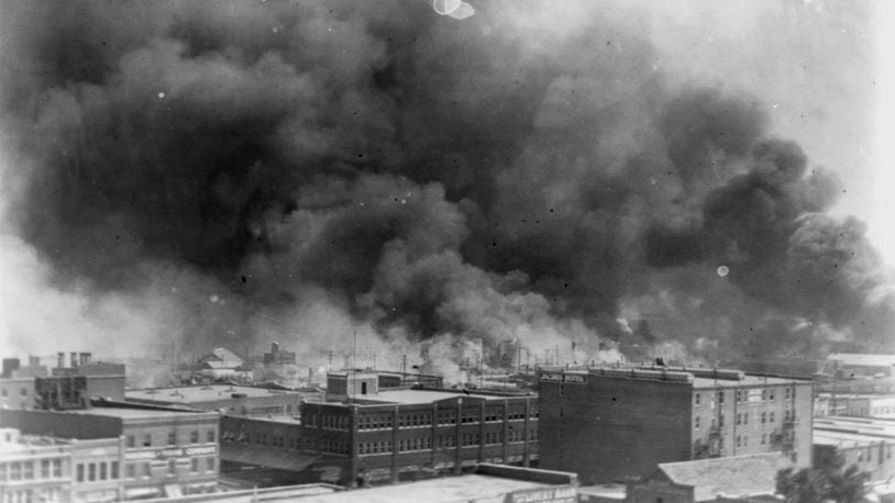 FILE - In this 1921 image provided by the Library of Congress, smoke billows over Tulsa, Okla. (Alvin C. Krupnick Co./Library of Congress via AP, File)