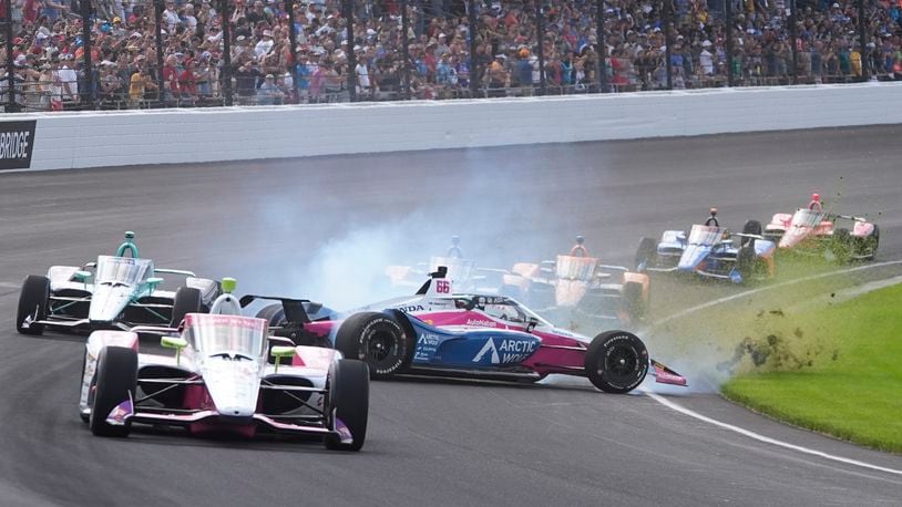 Tom Blomqvist (66), of England, wrecks during the Indianapolis 500 auto race at Indianapolis Motor Speedway, Sunday, May 26, 2024, in Indianapolis. (AP Photo/Darron Cummings)