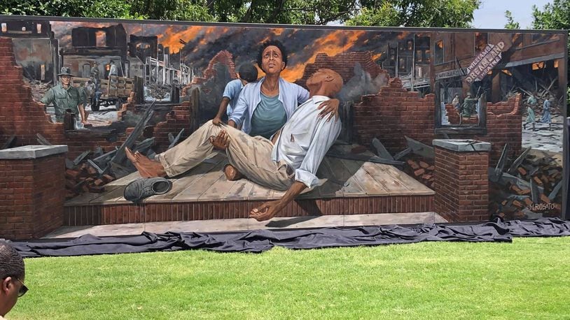 The mural depicting the 1921 Tulsa Race Massacre was painted by artist Michael Rosato and is opposite the Greenwood Cultural Center. CONTRIBUTED