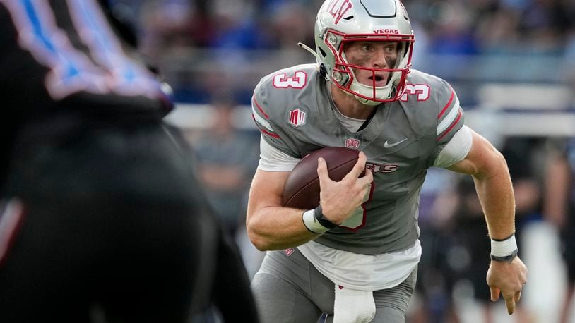 UNLV quarterback Matthew Sluka runs with the ball in the first half against Kansas during an NCAA college football game Friday, Sept. 13, 2024, at Children's Mercy Park in Kansas City, Kan. (AP Photo/Ed Zurga)