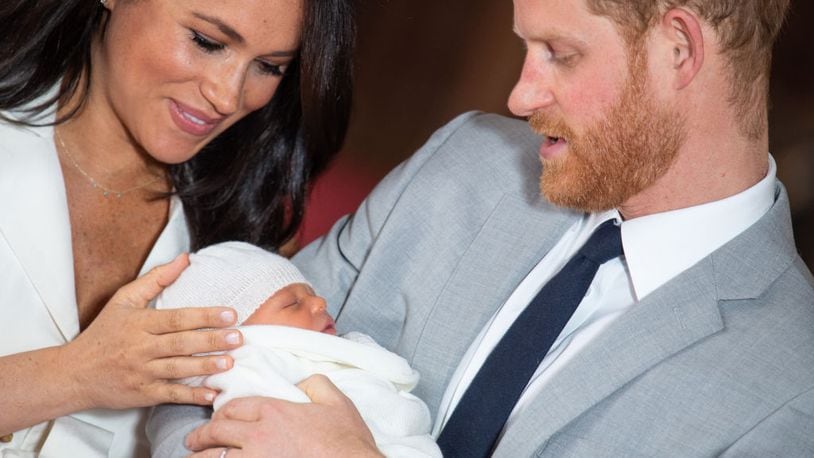 Prince Harry, Duke of Sussex and Meghan, Duchess of Sussex, pose with their newborn son Archie Harrison Mountbatten-Windsor during a photocall in St George's Hall at Windsor Castle on May 8, 2019 in Windsor, England. The Duchess of Sussex gave birth at 05:26 on Monday 06 May, 2019. On May 17, the baby's place of birth was revealed to be Portland Hospital in London.