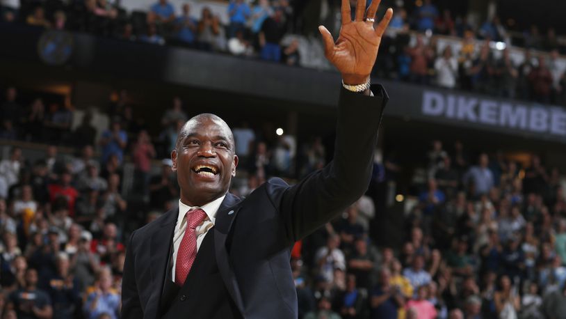 FILE - Retired Denver Nuggets center Dikembe Mutombo waves to the crowd as his jersey number was retired by the team during halftime of the Nuggets' NBA basketball game against the Portland Trail Blazers on Saturday, Oct. 29, 2016, in Denver. (AP Photo/David Zalubowski, File)