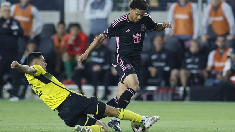 Inter Miami's David Ruiz, right, tries to kick the ball past Columbus Crew's Marcelo Herrera during the second half of an MLS soccer match, Wednesday, Oct. 2, 2024, in Columbus, Ohio. (AP Photo/Jay LaPrete)