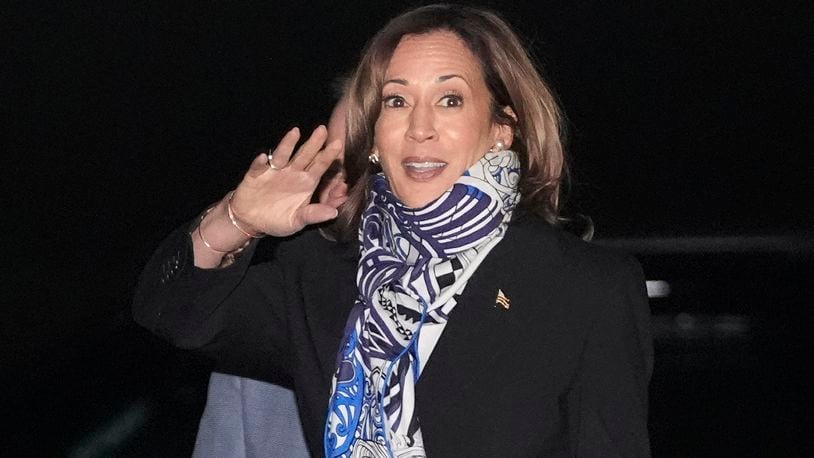 Democratic presidential nominee Vice President Kamala Harris waves as she arrives on Air Force Two at Detroit Metropolitan Wayne County Airport in Romulus, Mich., Thursday, Oct. 3, 2024. (AP Photo/Mark Schiefelbein)