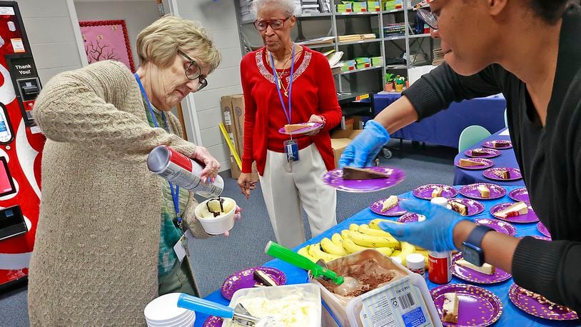 The staff at Fulton Elementary, from left, Sharon Bohn, Peggy Jones and April Turner, celebrate Teacher Appreciation Week on Wednesday, May 10, 2023, with a sundae and cheesecake bar on their lunch break. BILL LACKEY/STAFF