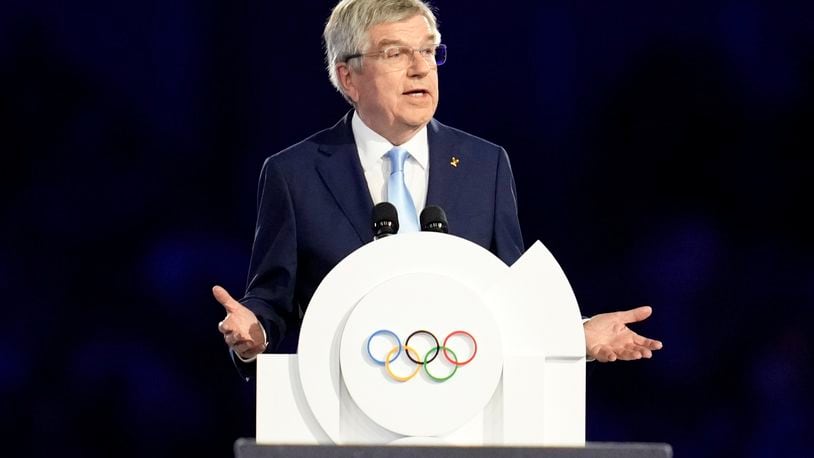 FILE - IOC President Thomas Bach addresses the audience during the 2024 Summer Olympics closing ceremony at the Stade de France, Aug. 11, 2024, in Saint-Denis, France. (AP Photo/Ashley Landis, File)