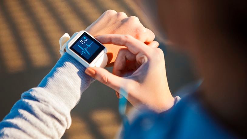 A smart watch or Fitbit wearables can help monitor your heart rate. iSTOCK/COX