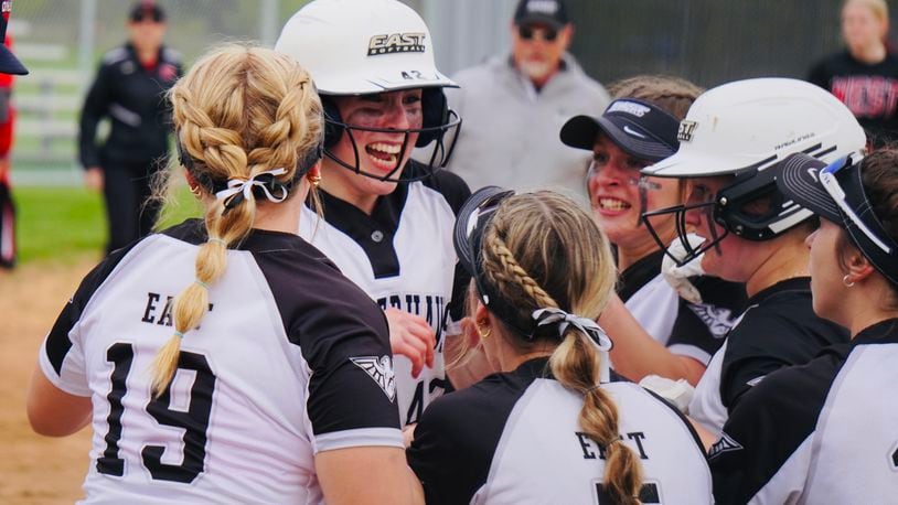 Lakota East's Amber Munoz is swarmed by her teammates after hitting a walk-off home run against Lakota West earlier this season Chris Vogt/CONTRIBUTED