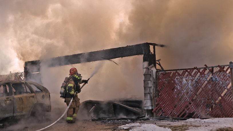 The Springfield Fire Division responded to a fully engulfed detached garage fire on Summit Street this year. The city is currently planning to invest millions in the construction of three new fire stations. BILL LACKEY/STAFF