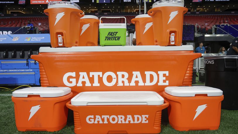 FILE - Gatorade containers are shown on the sideline prior to an NFL preseason football game between the Jacksonville Jaguars and Atlanta Falcons, Aug. 23, 2024, in Atlanta. (AP Photo/Stew Milne, File)