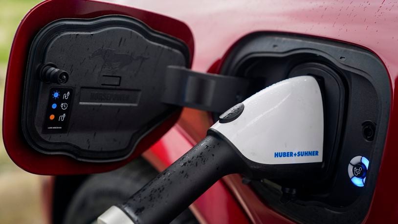 FILE - A 2023 Ford Mustang Mach-E charges, Friday, March 8, 2024, at an electric vehicle charging station in London, Ohio. (AP Photo/Joshua A. Bickel, File)