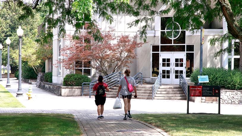 Two students walk across the campus of Wittenberg University Thursday, August 1, 2024. BILL LACKEY/STAFF