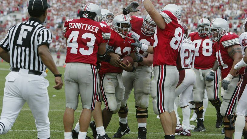 COLUMBUS, OH - SEPTEMBER 14:  Maurice Clarett #13 of Ohio State is congratulated by his teammates after his touchdown during the game against Washington State on September 14, 2002 at Ohio Stadium in Ohio.  Ohio State won the game, 25-7.  (Photo by Tom Pidgeon/Getty Images)