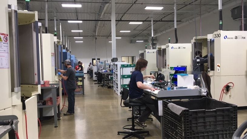 Employees at Norwood Medical in Dayton kept rows of CNC (computer numeric controlled) machines busy on a recent afternoon. THOMAS GNAU/STAFF