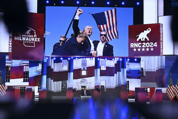 
                        An image of former President Donald after Saturday’s shooting is displayed as Donald Trump Jr. speaks on the third night of the Republican National Convention at the Fiserv Forum in Milwaukee, on Wednesday, July 17, 2024. (Kenny Holston/The New York Times)
                      