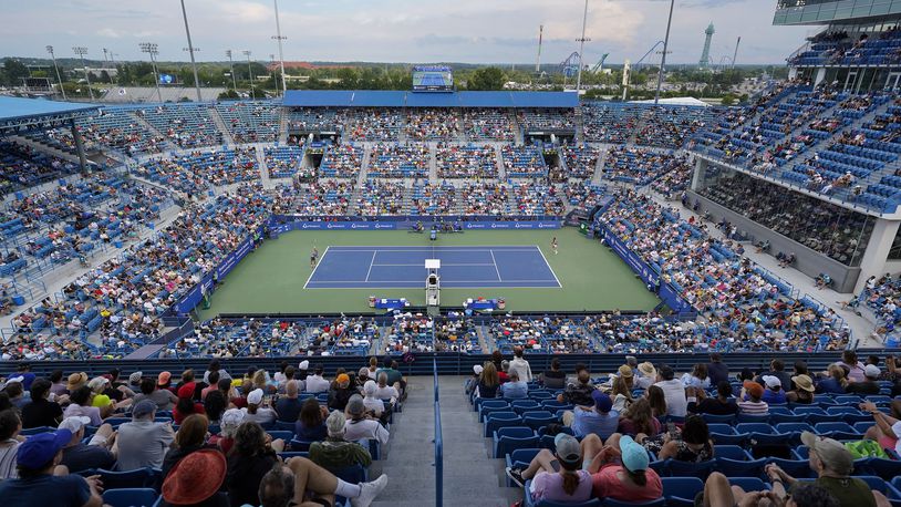 Borna Coric, left, of Croatia, serves to Stefanos Tsitsipas, of Greece, during the men's singles final of the Western & Southern Open tennis tournament Sunday, Aug. 21, 2022, in Mason, Ohio. (AP Photo/Jeff Dean)