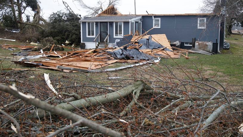 Damage to a house caused by Wednesday's tornado along Fletcher Pike. BILL LACKEY/STAFF