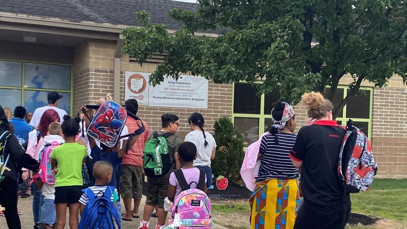 Kids and parents lined up before the first day of school started at Kemp Elementary, part of Dayton Public Schools, on Monday, Aug. 14, 2023. Eileen McClory / Staff