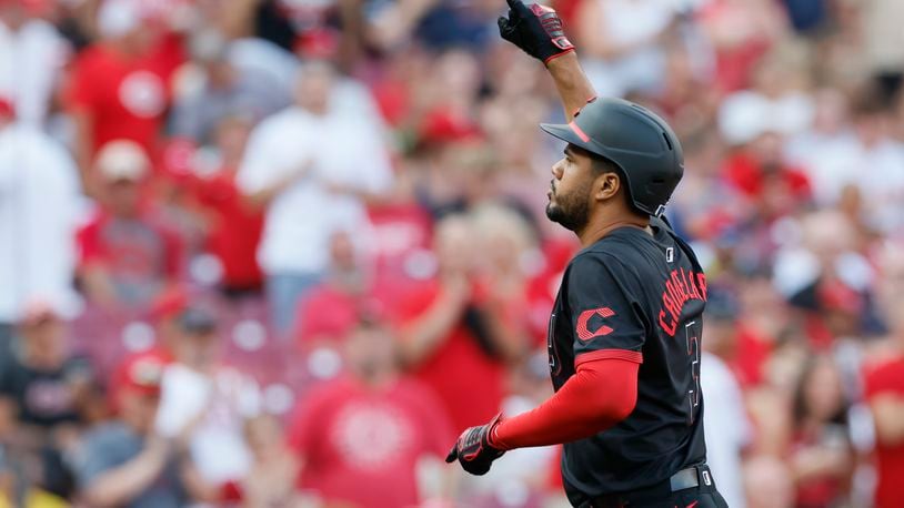 Cincinnati Reds' Jeimer Candelario celebrates his home run against the Boston Red Sox during the first inning of a baseball game Friday, June 21, 2024, in Cincinnati. (AP Photo/Jay LaPrete)