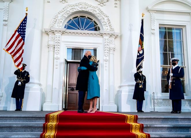 President Joe Biden and first lady Jill Biden embrace in front of the White House during the Presidential Escort, part of Inauguration Day ceremonies, in Washington on Jan. 20, 2021. (Doug Mills/The New York Times)