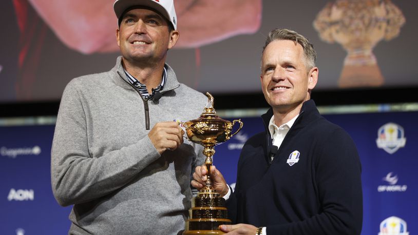 U.S. Ryder Cup team captain Keegan Bradley, left, and Europe team captain Luke Donald pose for a photo with the Ryder Cup trophy after a press conference in New York, Tuesday, Oct. 8, 2024, in New York. (AP Photo/Heather Khalifa)