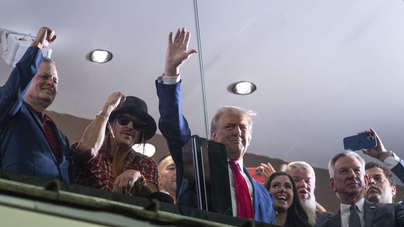 Republican presidential nominee former President Donald Trump waves to the crowd during the Georgia vs. Alabama football game at Bryant-Denny Stadium, Saturday, Sept. 28, 2024, in Tuscaloosa, Ala. (AP Photo/Evan Vucci)