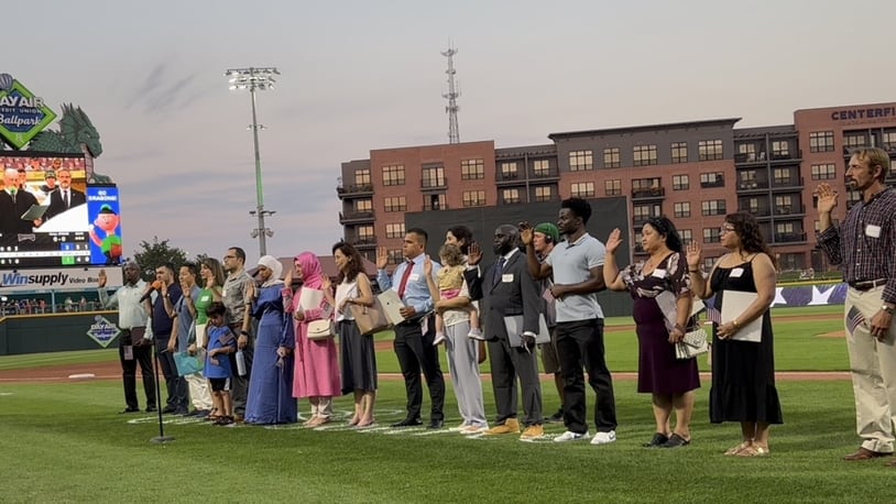 Twenty new United States citizens recited the oath that officially made them American citizens Tuesday Aug. 27, 2024, at a naturalization ceremony hosted by the Dayton Dragons between the third and fourth inning at Day Air Ballpark. CONTRIBUTED PHOTO