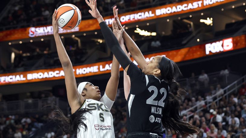 Chicago Sky forward Angel Reese (5) tries to shoot over Las Vegas Aces center A'ja Wilson (22) during the second half of an WNBA basketball game, Tuesday, Sept. 3, 2024, in Las Vegas. L (Steve Marcus/Las Vegas Sun via AP)