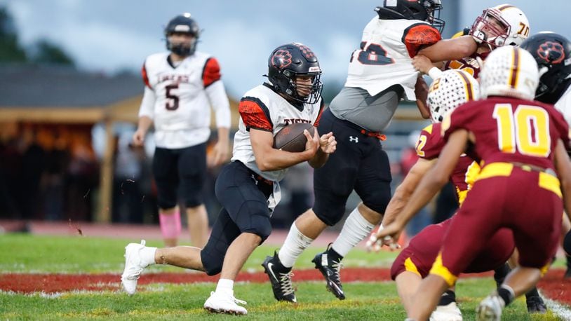 West Liberty-Salem High School senior Josiah Stidham runs the ball during their game against Northeastern on Friday night at Conover Stadium. The Tigers won 24-21. Michael Cooper/CONTRIBUTED