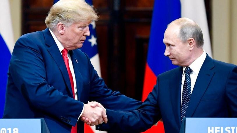 U.S. President Donald Trump and Russian President Vladimir Putin shake hands during a join press conference at the Presidential Palace in Helsinki, Finland, Monday, July 16, 2018. (Jussi Nukari/Lehtikuva via AP)