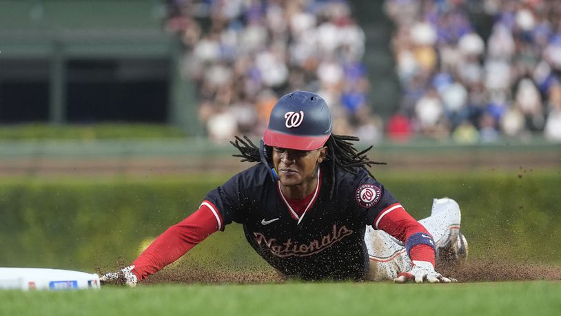 Washington Nationals' CJ Abrams steals third base during the first inning of a baseball game against the Chicago Cubs, Thursday, Sept. 19, 2024, in Chicago. (AP Photo/Erin Hooley)