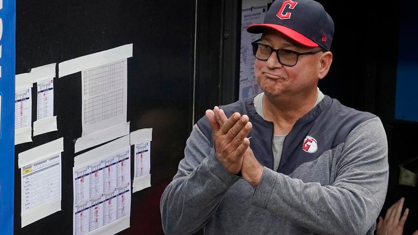 FILE -Cleveland Guardians manager Terry Francona applauds during a tribute video before the team's baseball game against the Cincinnati Reds, Wednesday, Sept. 27, 2023, in Cleveland. Terry Francona has been hired to manage the Cincinnati Reds, returning to the major leagues a year after he stepped down in Cleveland because of health. A person familiar with the situation confirmed the move on Thursday, Oct. 3, 2024 on condition of anonymity because the Reds had not announced the decision.(AP Photo/Sue Ogrocki, File)