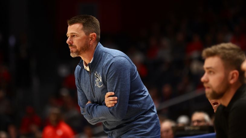 Cedarville's Pat Estepp coaches during a exhibition game against Dayton on Saturday, Oct. 28, 2023, at UD Arena. David Jablonski/Staff