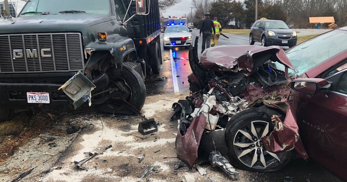 Driver taken to hospital following car vs dump truck crash