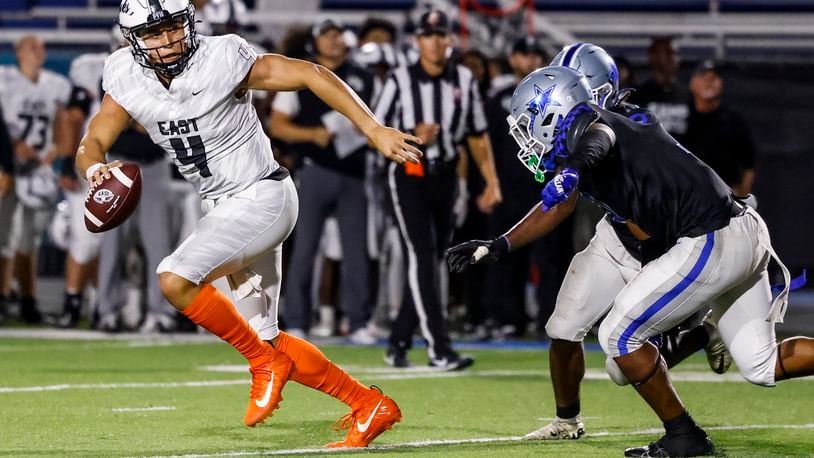 Lakota East quarterback Jamison Kitna runs the ball during their football game Friday, Sept. 6, 2024 at Hamilton's Virgil M. Schwarm Stadium. Lakota East won 27-24 in overtime. NICK GRAHAM/STAFF