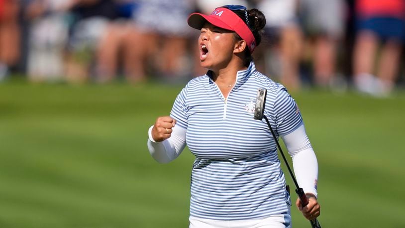 United States' Megan Khang celebrates after making a putt on the 14th hole during a Solheim Cup golf tournament fourball match at Robert Trent Jones Golf Club, Saturday, Sept. 14, 2024, in Gainesville, Va. (AP Photo/Chris Szagola)