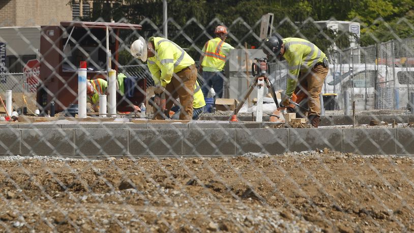 Work continues on the Global Impact STEM Academy's new "Upper Academy" facility on the Clark State Campus Tuesday, April 30, 2024. BILL LACKEY/STAFF