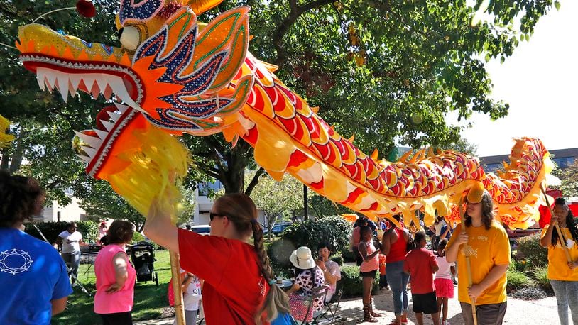 A Chinese dragon dances through the crowd at CultureFest in downtown Springfield.