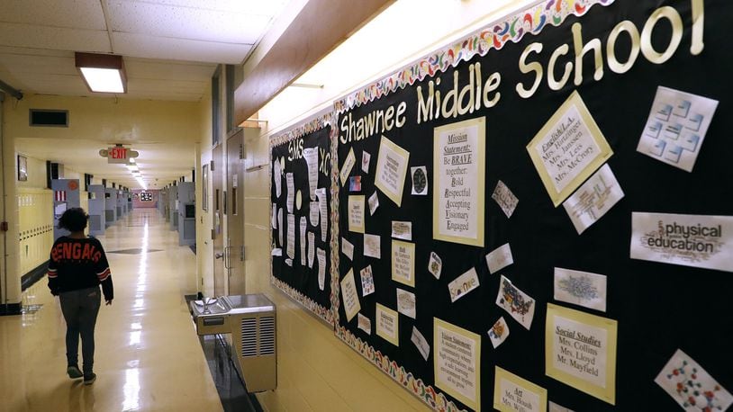 A middle school student walks down the hall in the middle school at Clark-Shawnee in this file photo. Bill Lackey/Staff