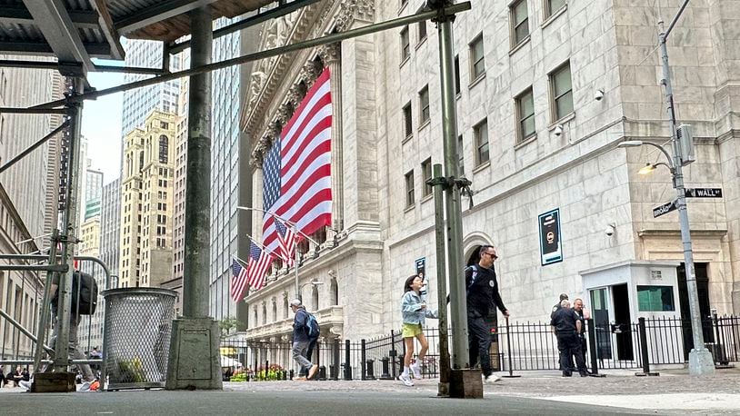 The American flag hangs from the front of the New York Stock Exchange on Wednesday, Sept. 11, 2024, in New York. (AP Photo/Peter Morgan)