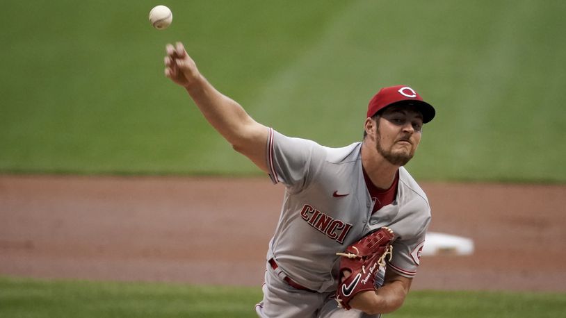 Cincinnati Reds starting pitcher Trevor Bauer throws during the first inning of a baseball game against the Milwaukee Brewers Friday, Aug. 7, 2020, in Milwaukee. (AP Photo/Morry Gash)