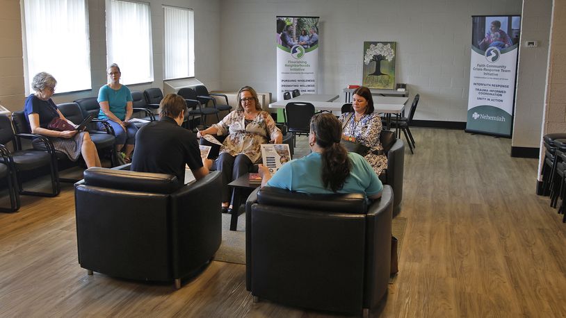 The Nehemiah Foundation's Amy Wilmann, center, talks about the foundation's new location in The Metropolis  Friday, June 21, 2024 during a tour of their new facilities. BILL LACKEY/STAFF